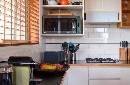 Tomakin House | Creative Three Level Retreat with Lovely Sea Views