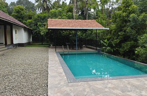 Pala House | Kerala style heritage pool villa on western ghats.