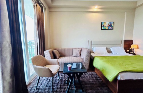 Jaypee Greens Apartment | PrimeStays Studio | Couples, Work & Travel Ready near expo mart greater noida