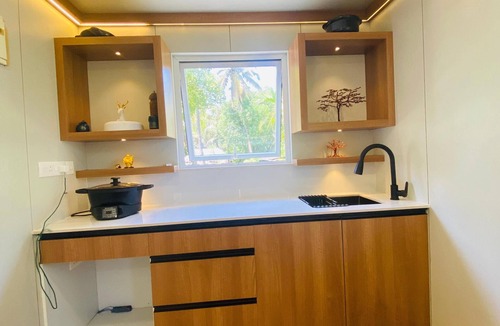 North Paravur House | This tiny home offers the perfect blend of modern comfort and seaside charm.
