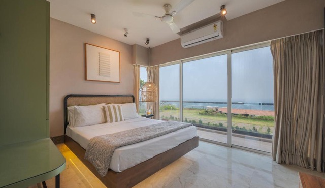 SaffronStays Nautica - 5BR hilltop villa with rooftop pool, sea views & modern interiors surrounded by greenery