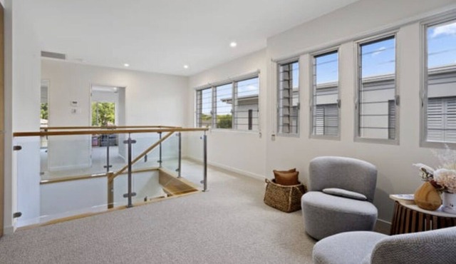 Waterfront villa with a pool and jetty in Biggera Waters