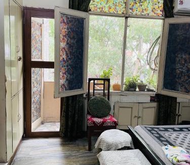 Chittaranjan Apartment | Deluxe Designer Room with Aerial Green View C R Park