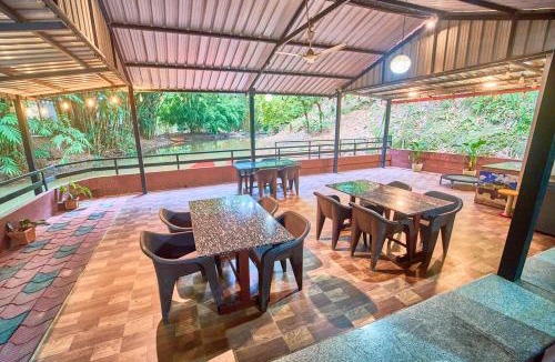 Virajpet Resort | Cave Ritz Coorg by VOYE HOMES - Cottages with Guided Plantation walks and Treks - Pet Friendly