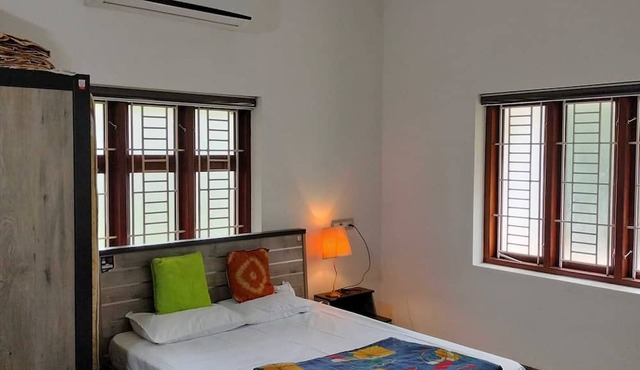 Spacious 4-bedroom house with WiFi, AC in serene Kannur